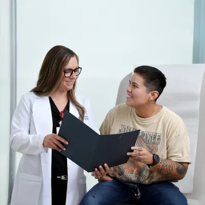A Plastic Surgeon Consults a Patient on Surgery