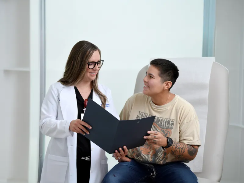 A Plastic Surgeon Consults a Patient on Surgery