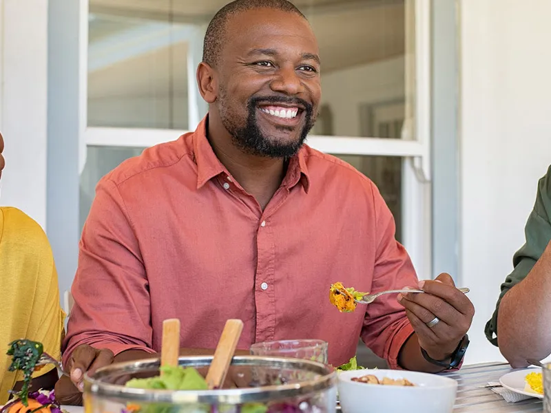 man eating salad
