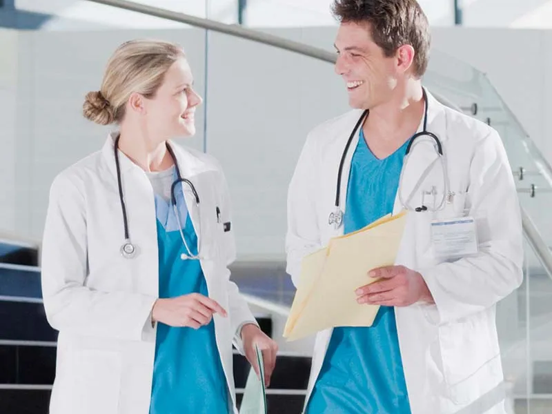 Male and female doctors chatting