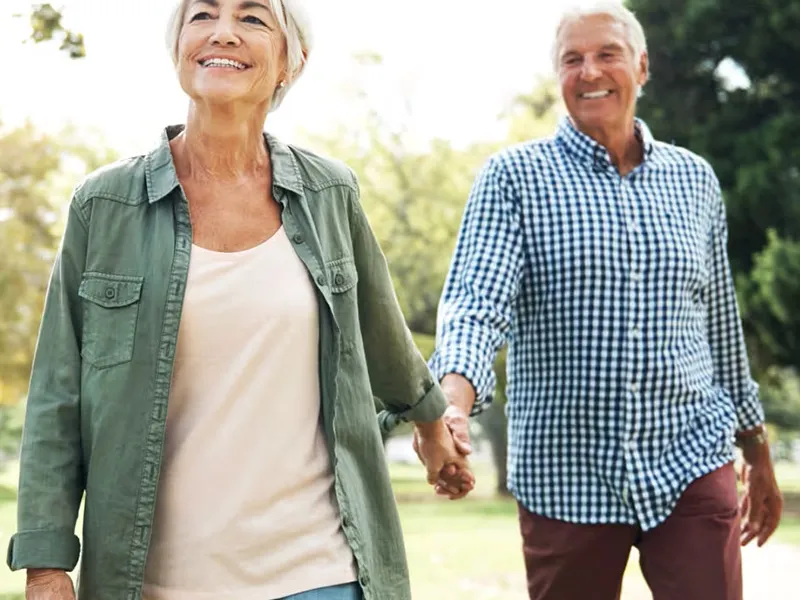 older-couple-holding-hands-outdoors