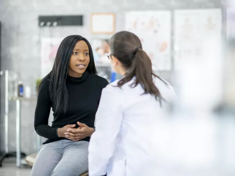 Millennial woman with primary care doctor