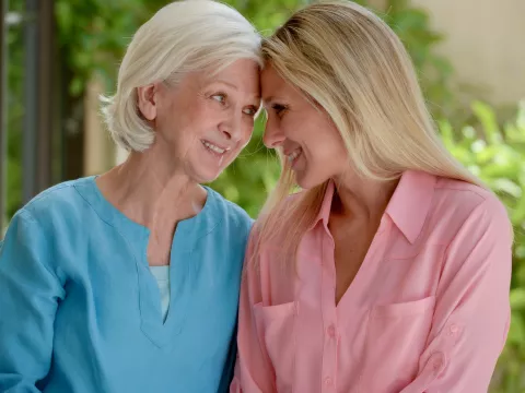 An adult daughter and mother spend time together.