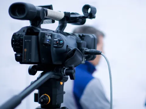 Behind-the-scenes on an interview shoot with reporter