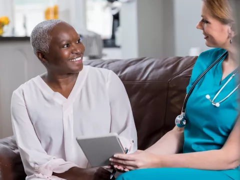 A woman reviews her test results with her doctor.