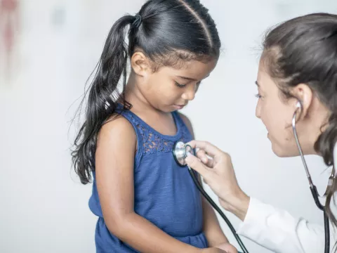 Little girl at doctor stethoscope