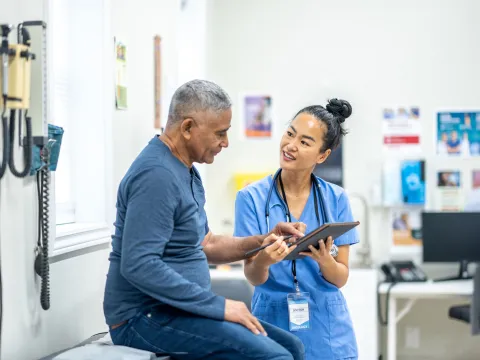 physician-showing-a-chart-to-a-patient