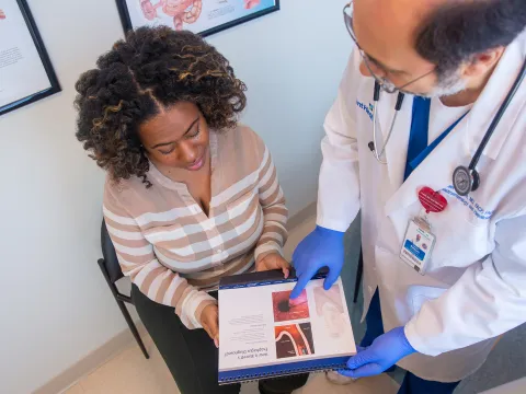 Doctor Yasser Saloum showing patient picture.