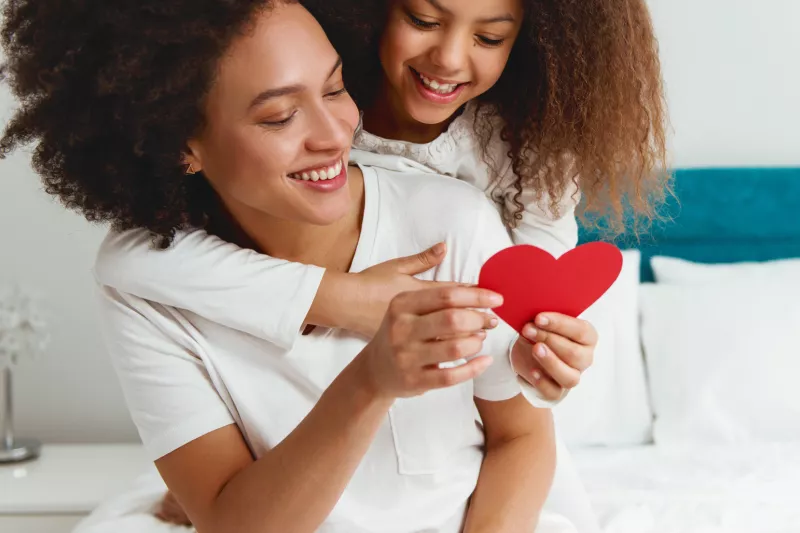 Woman and daughter with heart