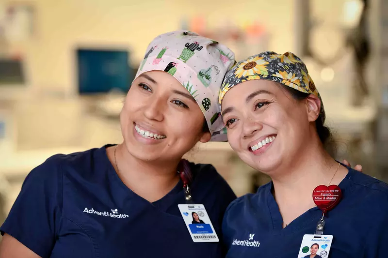 Two AdventHealth nurses smiling together