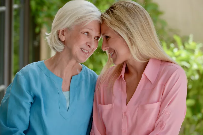 An adult daughter and mother spend time together.