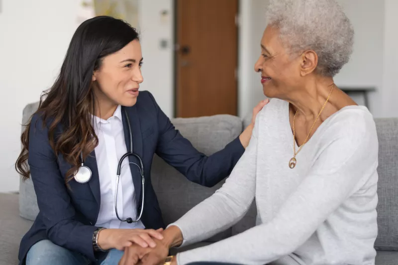 A woman talk with her doctor about what to expect following her visit.