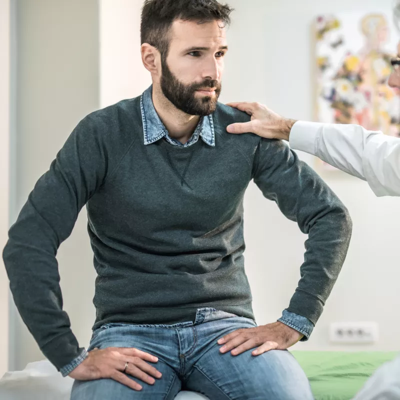 Man at doctor's office for pelvic floor issues