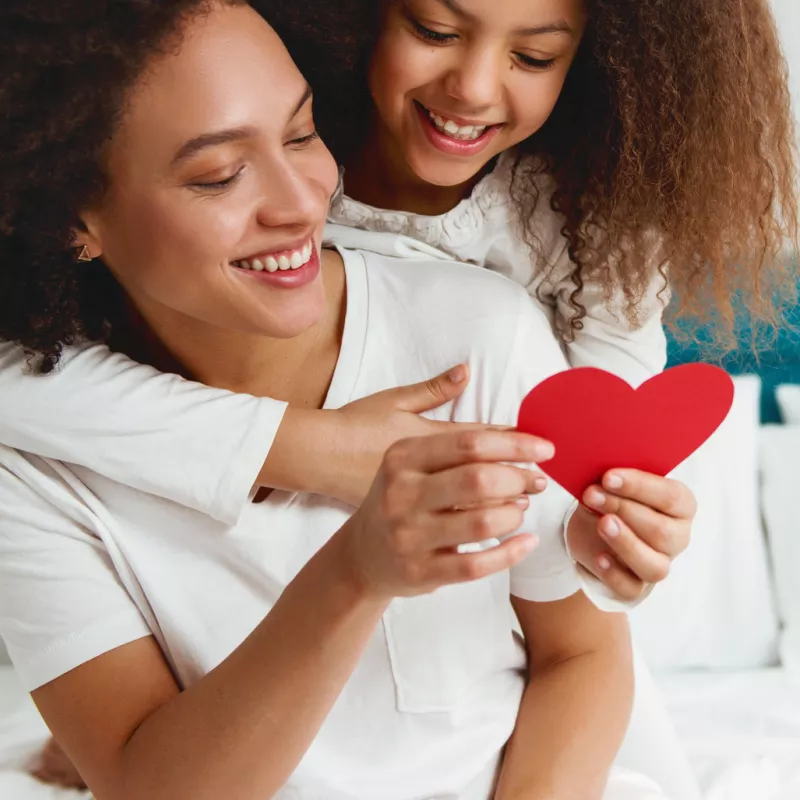 Woman and daughter with heart