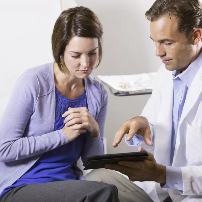 Woman reviewing chart with her doctor