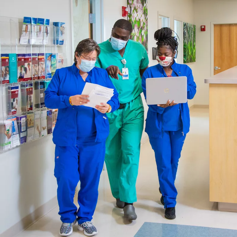 AdventHealth Digestive Health Institute team members walking down a hallway.