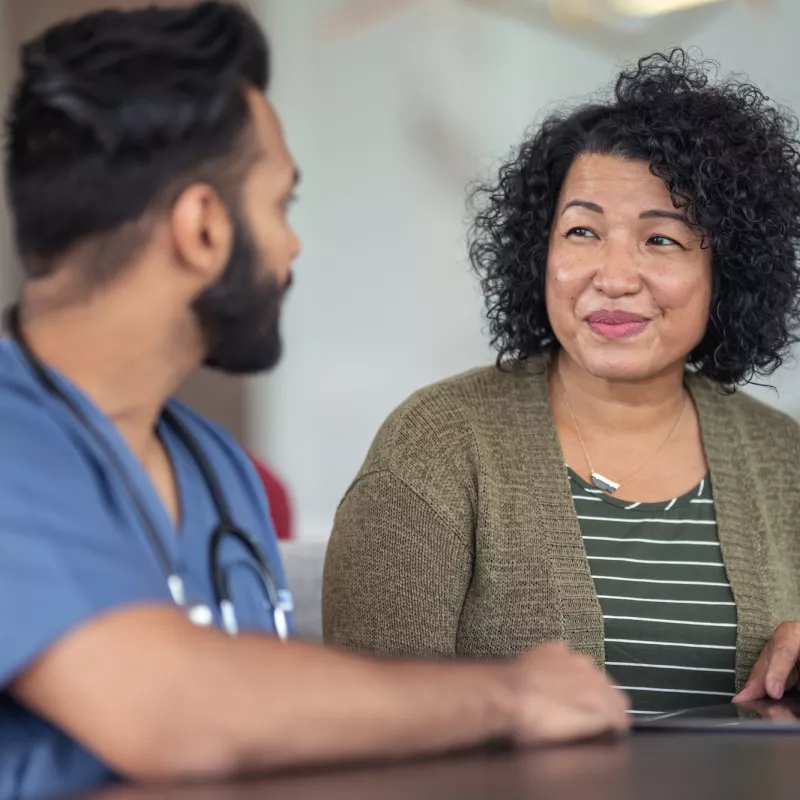 A woman meets with her doctor.