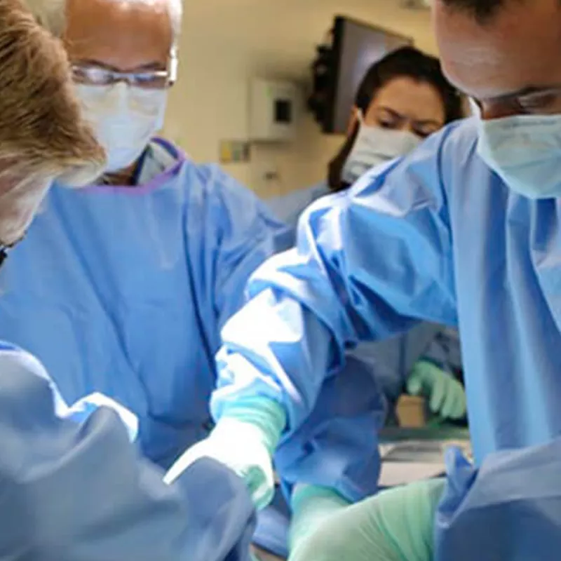 Surgeons operating on a patient.