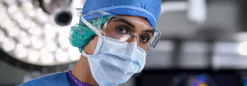 Female surgeon wearing mask